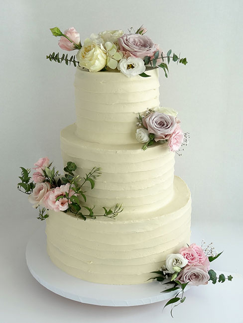 3-tier wedding cake with fresh flowers