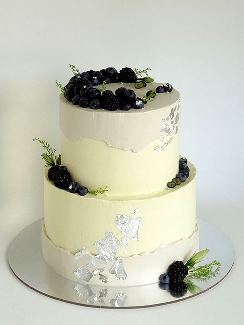 2-tier anniversary cake with blueberries and silver leaf