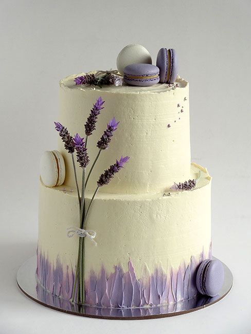 2-tier wedding cake with lavender and macarons